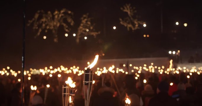 Burning torches at torchlight procession at night people protest