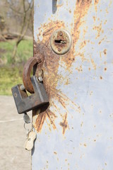 Iron lock on a metal safe with a paint wrapper.