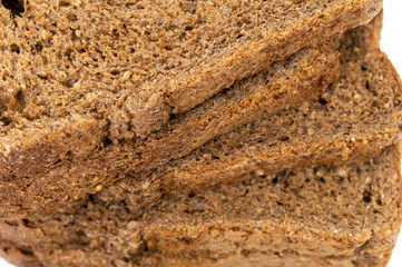 whole grain bread on white background, macro photo, selective focus, front top view