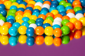 Colorful bubble gum spilling. Macro with shallow dof. Selective focus.