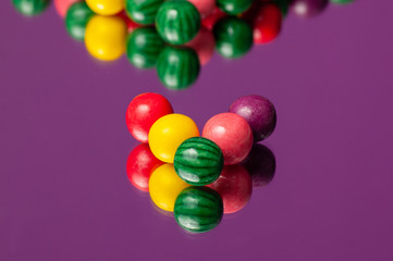 Colorful bubble gum spilling. Macro with shallow dof. Selective focus.