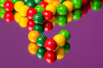 Colorful bubble gum spilling. Macro with shallow dof. Selective focus.