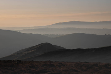 Sunrise over the misty Shropshire Hills, England, UK