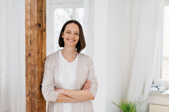 Smiling relaxed woman indoors at home