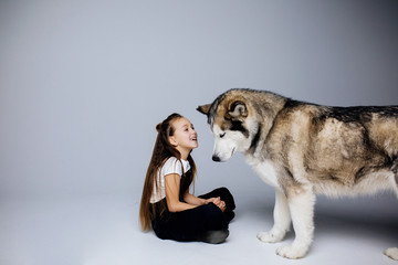 teenager plays with his dog