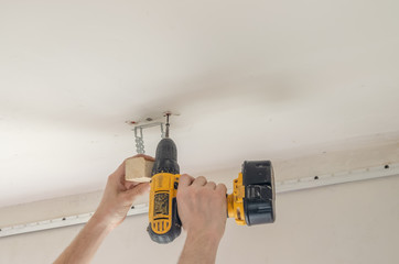 Installation of ceiling curtains. Niche for stretch ceiling. Preparing for installation of a stretch ceiling © yaroslav1986