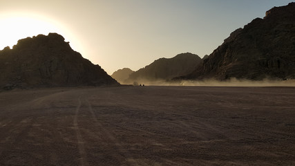 Sunset in the desert in Egypt. Mountain cliff in the desert at sunset. Nature and landscape.