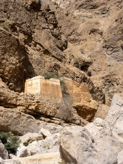 Wadi Shab, beautiful scenery, high rocks, stream with clear water. Oman
