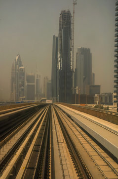 the Dubai Metro, MRT, in motion along Sheikh Zayed road with the skyline in the background, Dubai, United Arab Emirates © MF1688