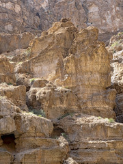 Wadi Shab, beautiful scenery, high rocks, stream with clear water. Oman