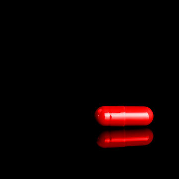 Red Pill Isolated On Black Background