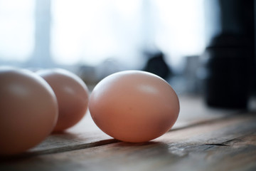 Eggs are laid on a wooden floor.
