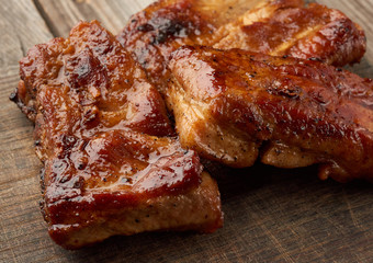 fried pork ribs on a brown wooden board