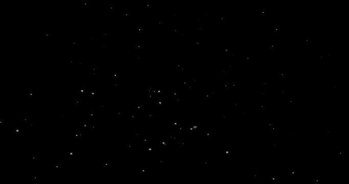 Flying dust particles on a black background