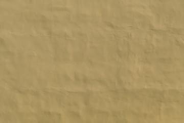 Texture of the walls covered with beige stucco