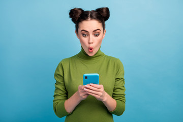 Photo of attractive shocked teen lady open mouth browsing telephone read blog post addicted smart...