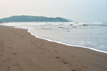 mornings on the beach water dust rock