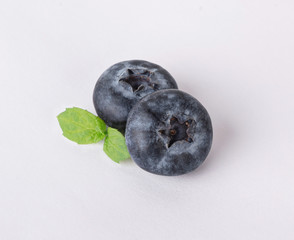 blueberries with mint isolated on a white background
