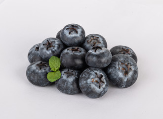 blueberries with mint isolated on a white background