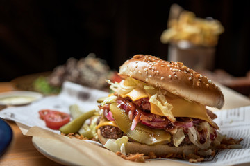hamburgers in a cafe in a composition with pizza, salad, potatoes