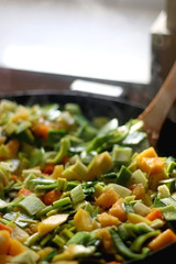 Chopped leek, carrot and butternut squash in a wok. Selective focus.