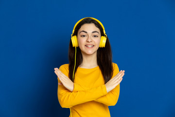 Brunette young girl wearing yellow jersey