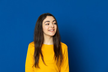 Brunette young girl wearing yellow jersey