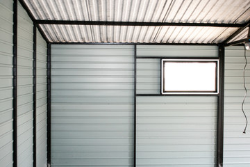 Fototapeta na wymiar Metal wall construction from inside. Mobile garage building