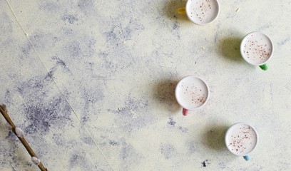 Cute baby cappuccinos or babyccino macchiato flat lay image with copy space