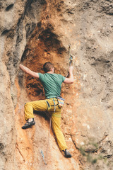Man climbs a rock. 
