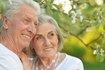 Portrait of beautiful senior couple posing in the park