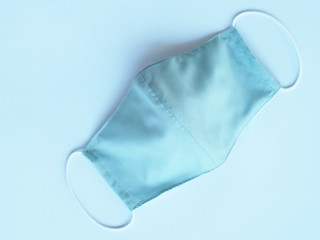 protective face mask on blue background