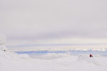 skiers in mountains