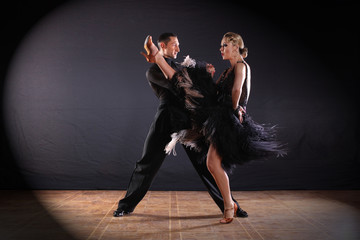 dancers in ballroom isolated on black background