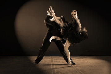 dancers in ballroom isolated on black background