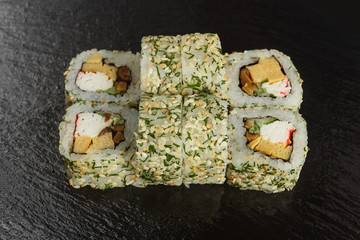 Japanese food: Set of salmon sushi and rolls with salmon and eel