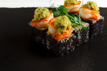 Japanese food: Set of salmon sushi and rolls with salmon and eel