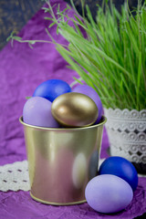 Easter eggs in a bucket of grass