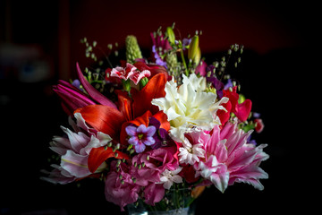 wedding flower arrangement  in shades of pink, white and red