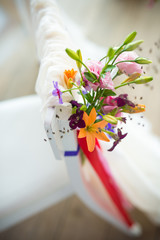 weddingflower arrangement in orange, pink and purple
