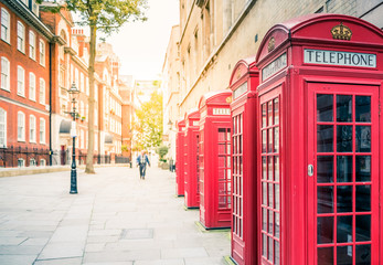 Fototapeta na wymiar Traditional telephone boxes in London, UK