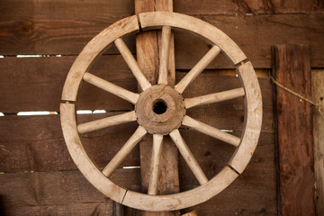 Old wooden cartwheel on a farm