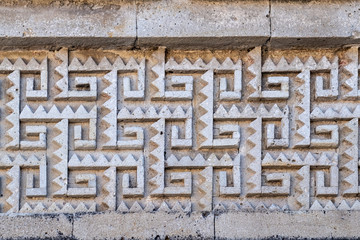 Zapotec geometric design stone fretwork (called grecas in Spanish) in the friezes at Mitla archeological site, Oaxaca, Mexico.