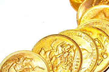 A Collection of Gold Sovereign Coins on White Background