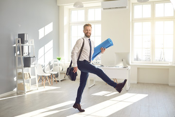 Funny businessman with a beard with a yoga mat goes for a workout in the office.