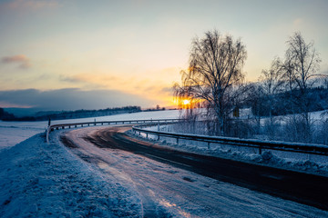 winter landscape with sunrise and blue sky