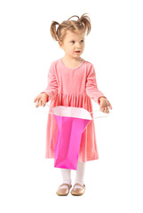 Cute little girl with shopping bag on white background