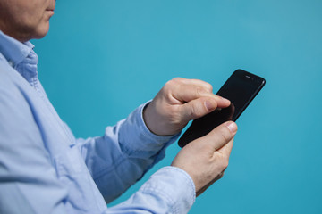 Man touches smartphone with a finger.