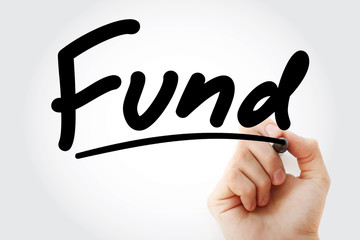 Hand writing FUND with marker, business concept background