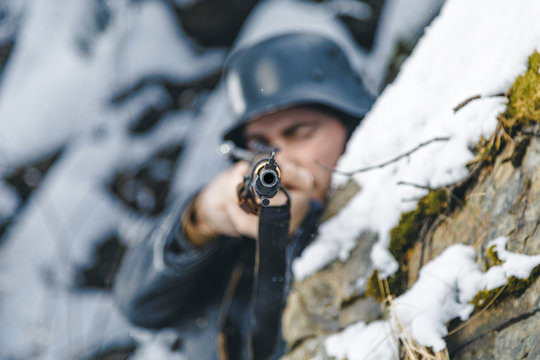 Soldier with a rifle in winter. Historical reenactment of Finnish army